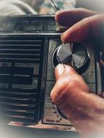 close up of a hand holding a radio photo