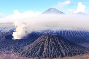 Scenic view of Bromo mountain with smoke in the morning. Bromo Mountain, Indonesia photo