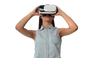 Young woman in virtual reality VR glasses. photo