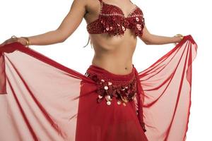 Beautiful belly dancer young woman in gorgeous red and black costume dress photo