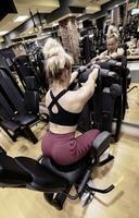 Woman doing a workout at the fitness gym. photo