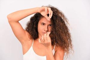 woman with messy curly hair on white background photo