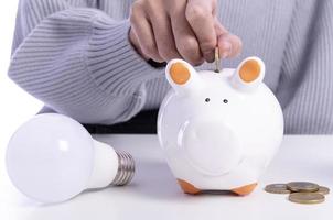 couple saving money in piggy bank photo