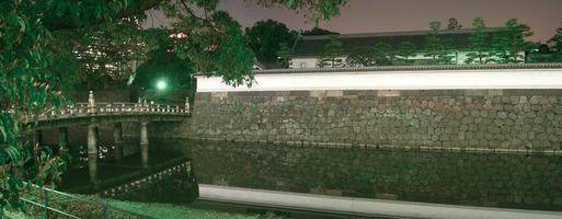 Tokyo, Japan Imperial Palace outer moat at night. photo