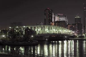 Eitai-bashi Bridge near the Monzen-nakacho area crossing the Sumida River in Tokyo, Japan at night. photo