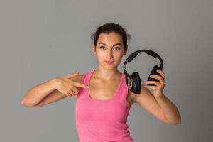 girl with headphones in studio photo