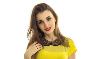 Portrait of a beautiful young girl with red lipstick and bright clothes close-up photo
