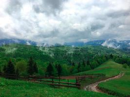 clouds rise up straight from the mountains photo