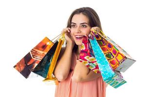 happy young girl holding a large colored packages close-up photo