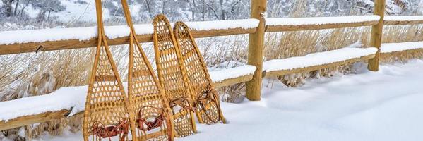 classic wooden snowshoes in winter scenery at Colorado foothills photo