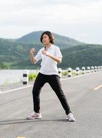 Woman short hair doing exercising outdoor photo