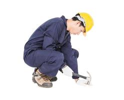 Handyman in uniform with his hammer photo