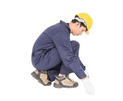 Young worker in unifrom with tape measure isolated on white photo