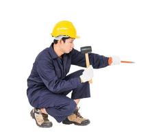 Man hold hammer and cold chisel on white photo