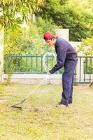 Gardener with garden tools at work photo