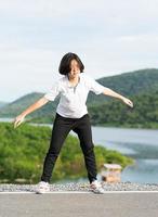 Woman doing exercising and warm up outdoor photo