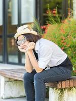 Women with short hair wearing hat in park photo