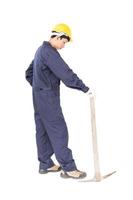 Man in uniform hold old pick mattock that is a mining device photo