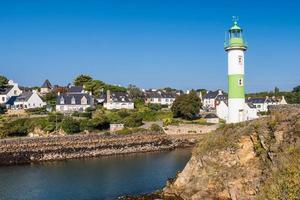 Scenic view of lighthouse in Clohars Carnoet in Brittany France during low tide photo