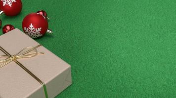 The red Christmas balls and gift box on green background  3d rendering photo
