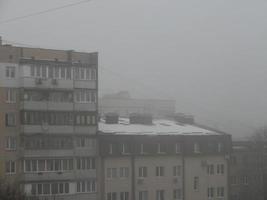 Foggy city with the houses photo