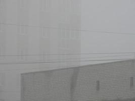 Foggy city with the houses photo