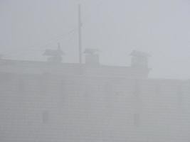 Foggy city with the houses photo