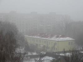 Foggy city with the houses photo