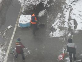 Cleaning the street with snow wipers in winter photo