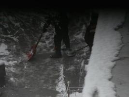 Cleaning the street with snow wipers in winter photo