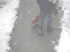 Cleaning the street with snow wipers in winter photo