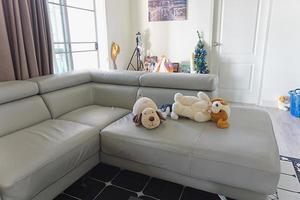 living room untidy  with the doll on a couch - sofa in a living room no people photo