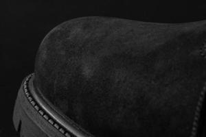 Black leather man shoe closeup photo