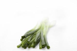 Green Scallion in nature on a white background photo