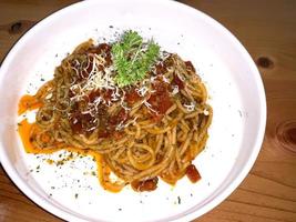 Delicious Spaghetti Bolognese, Pasta with meat, tuna, and tomato sauce and vegetables photo