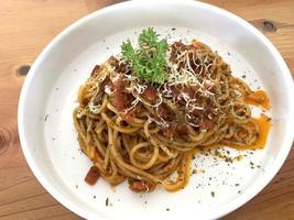 Delicious Spaghetti Bolognese, Pasta with meat, tuna, and tomato sauce and vegetables photo