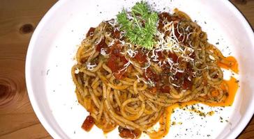 Delicious Spaghetti Bolognese, Pasta with meat, tuna, and tomato sauce and vegetables photo