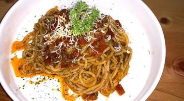 Delicious Spaghetti Bolognese, Pasta with meat, tuna, and tomato sauce and vegetables photo