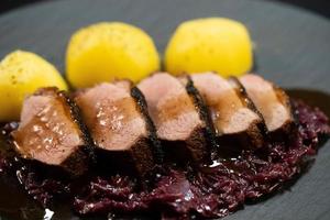 christmas dinner fried Duck breast with red cabbage photo