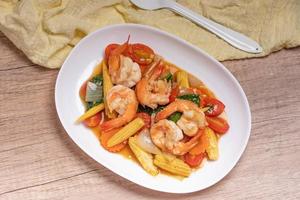 Stir-fried mixed vegetables with shrimp. In a white plate, healthy food concept. photo