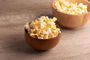 Popcorn in a wooden cup. Snacks. photo