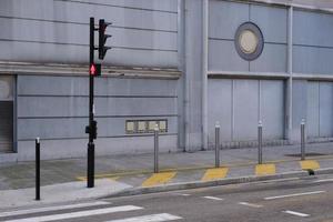 A crosswalk with traffic lights on the street outdoors. photo