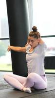 Woman stretching in gym video