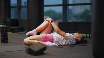 Woman stretching in gym video