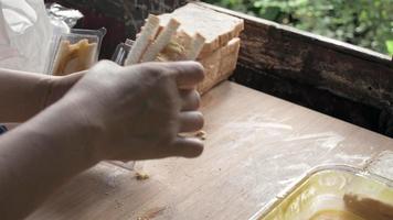 woman cooking sandwiches on a wooden board at the kitchen video
