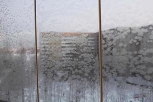 frosty patterns on window panes in winter photo