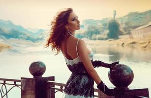 Female posing near river outdoors photo