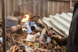 Hands in gloves with welding machine photo