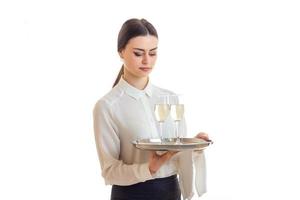 pretty young waitress with trey in hands in uniform photo