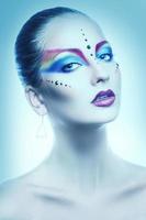 Sexy portrait of female with multicolor make up in cold tones photo